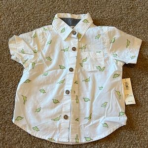 Old Navy BNWT dinosaur button down shirt.  6-12 months.